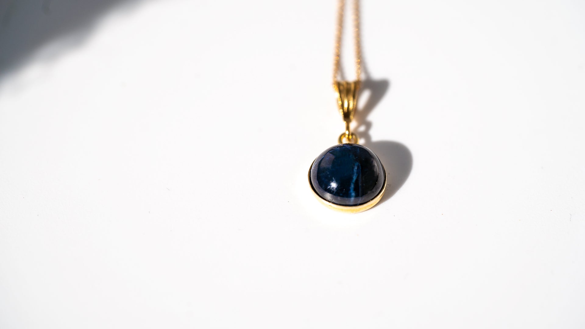 10MM Rough Dark Sapphire with 6 Point Hidden Star with 14K Gold-Filled over 925 Sterling Silver Setting with 16 inch 14K Gold Filled 925 Sterling Silver Necklace.
